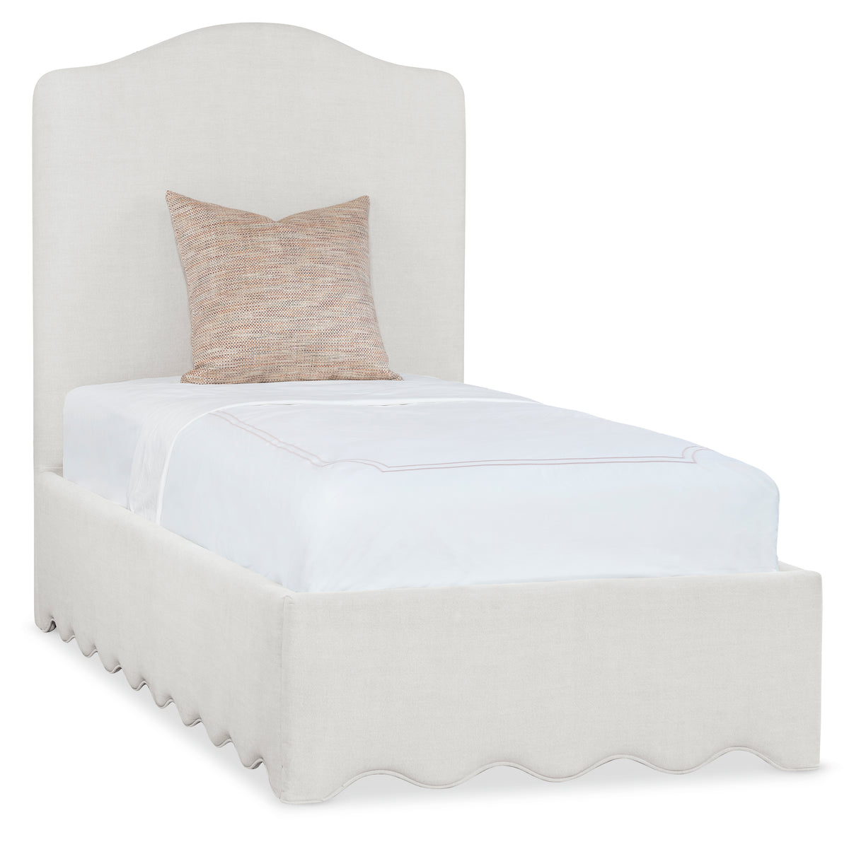 a white bed with a pillow