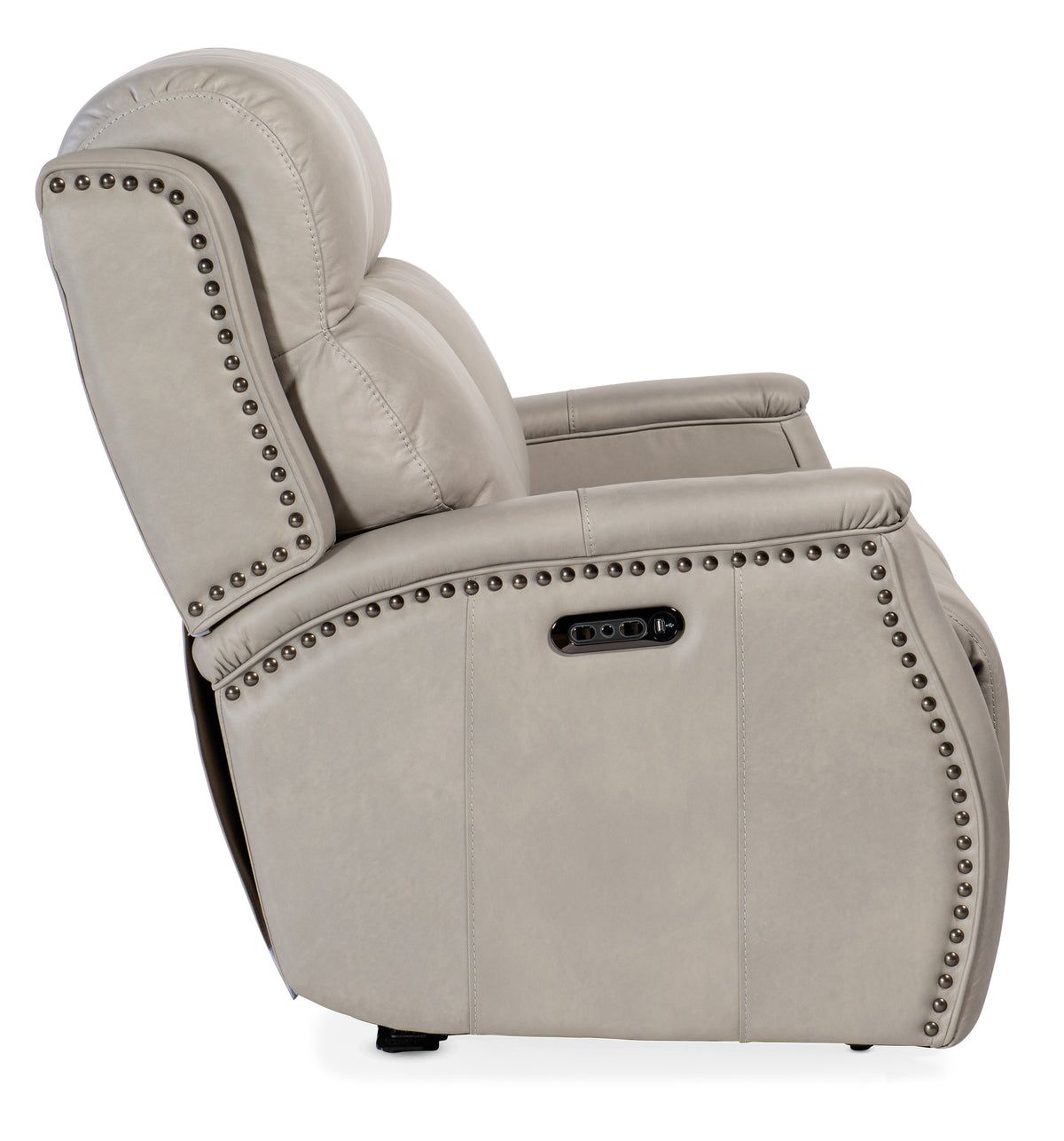 a white recliner with studs