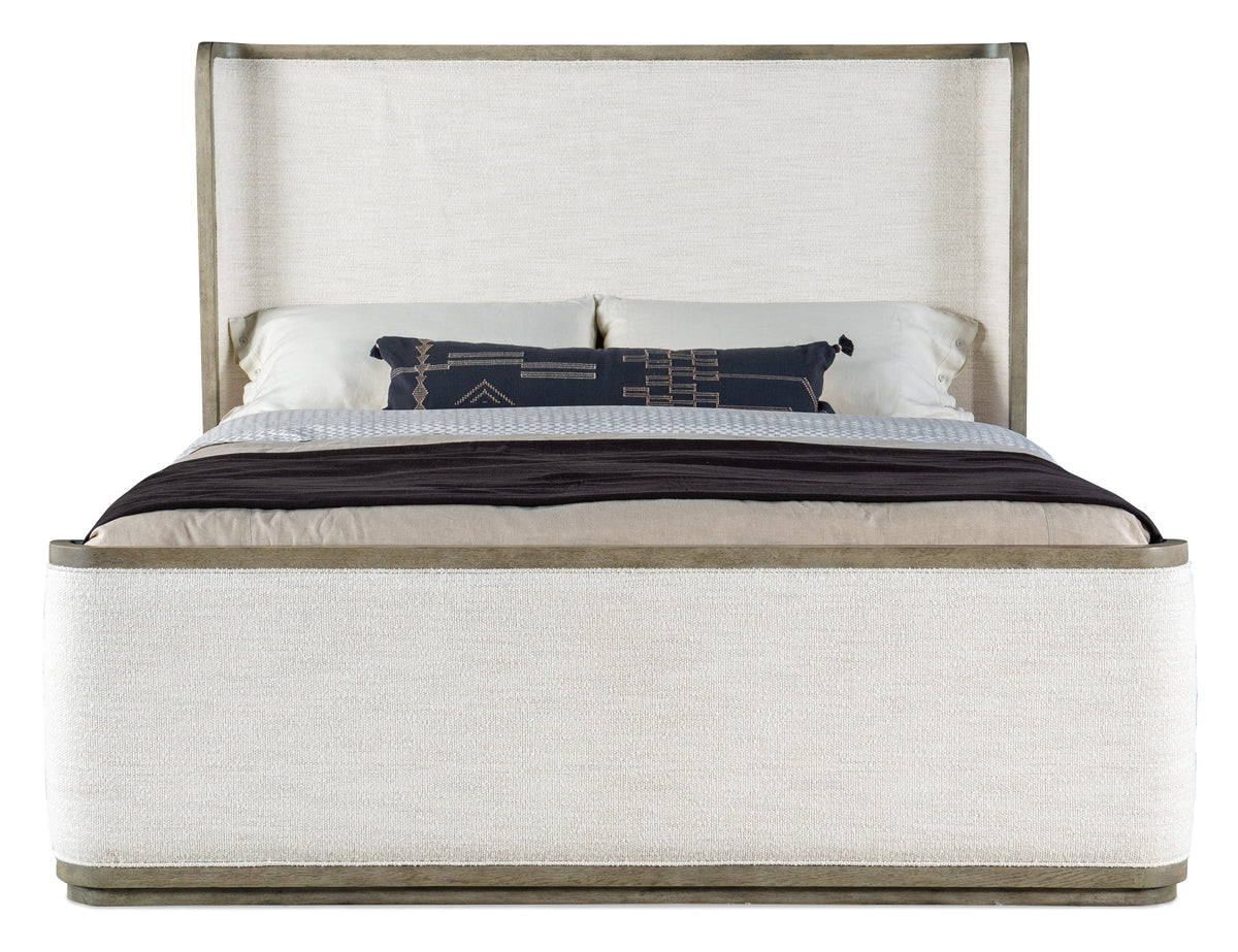 a bed with a white headboard