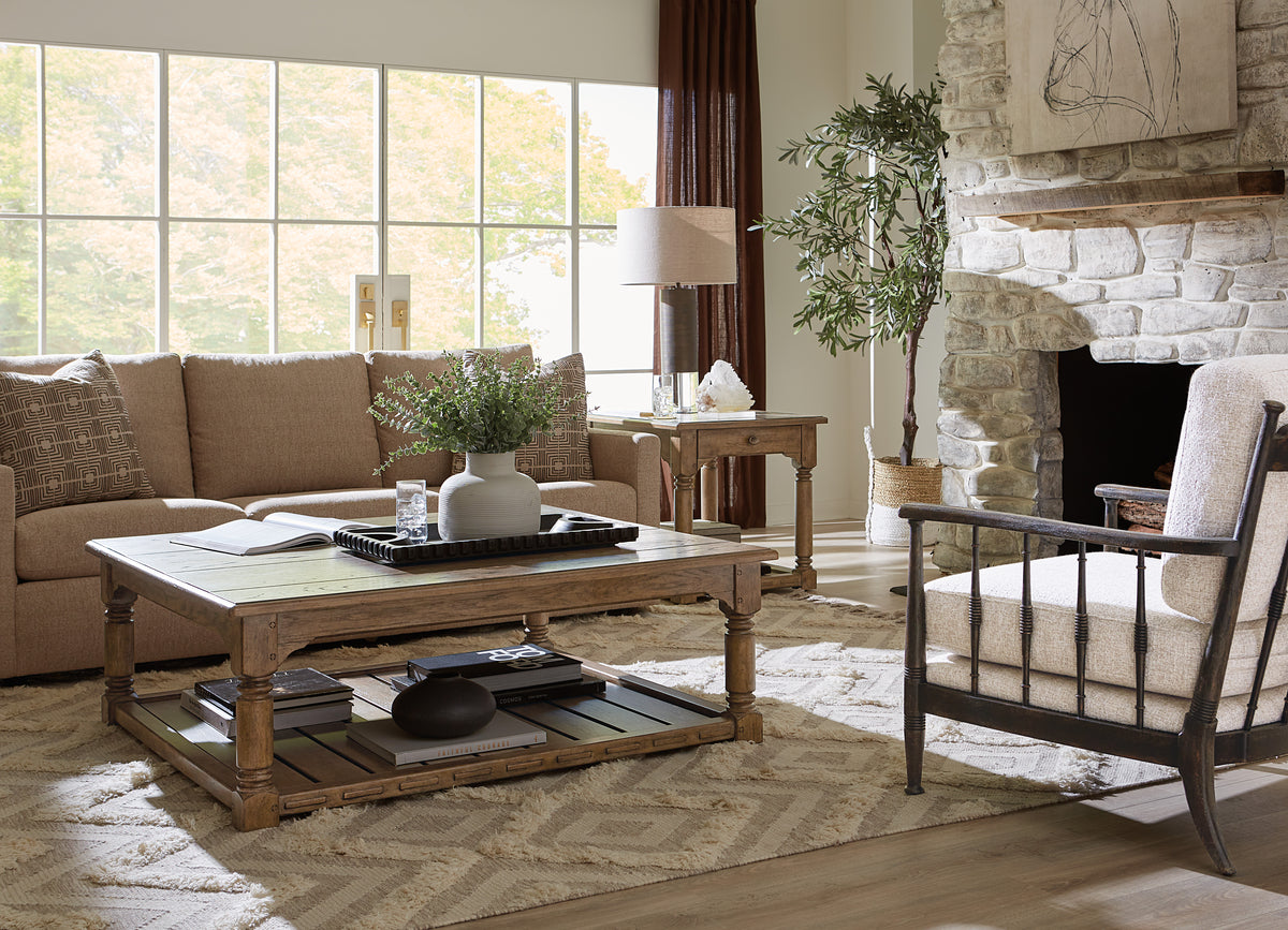 a living room with a couch and a fireplace