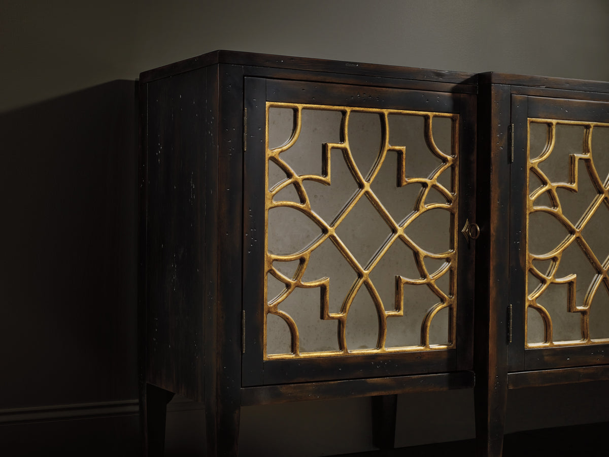 a black cabinet with gold designs