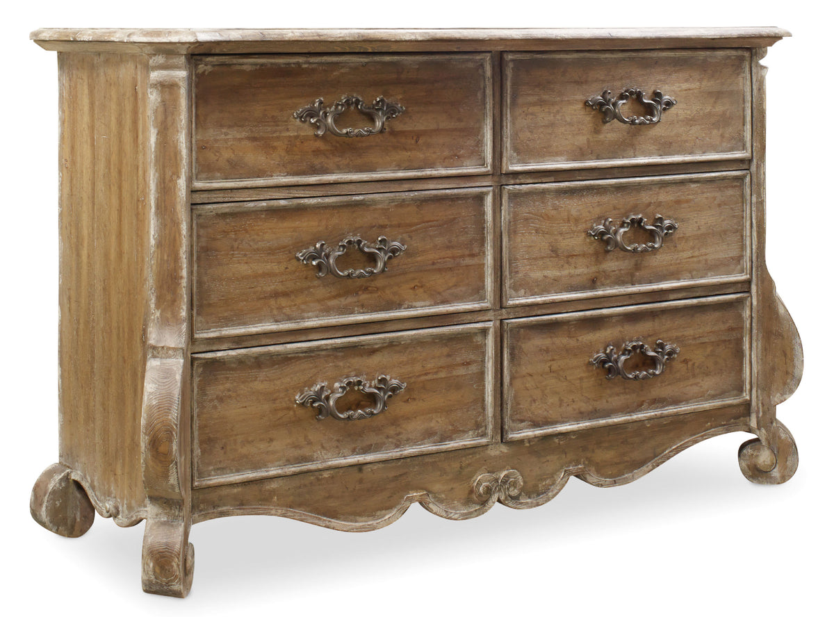 a wooden dresser with metal handles