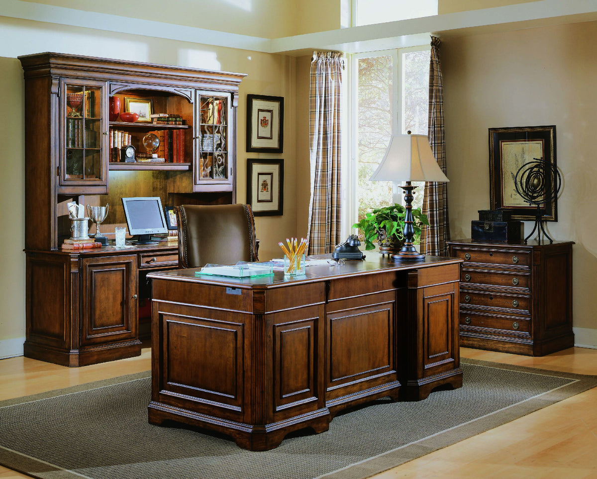 a room with a desk and a bookcase