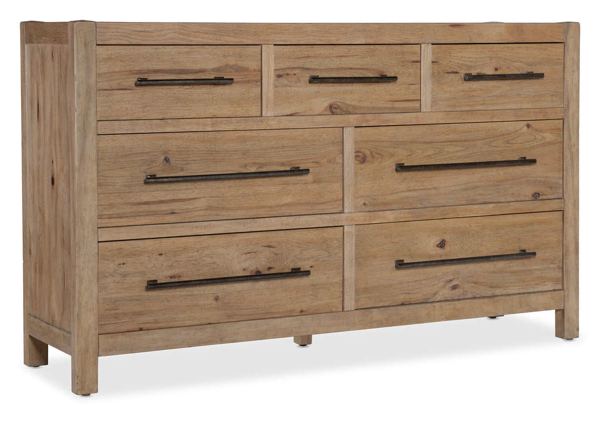 a wooden dresser with black handles