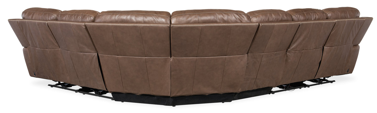 a brown leather couch with black base