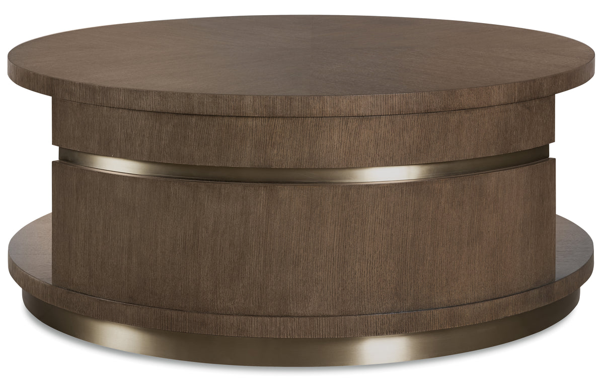 a round brown table with a silver band