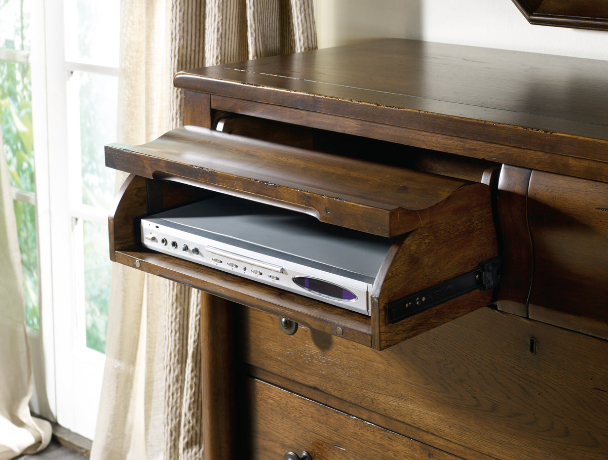 a wooden dresser with a dvd player in it