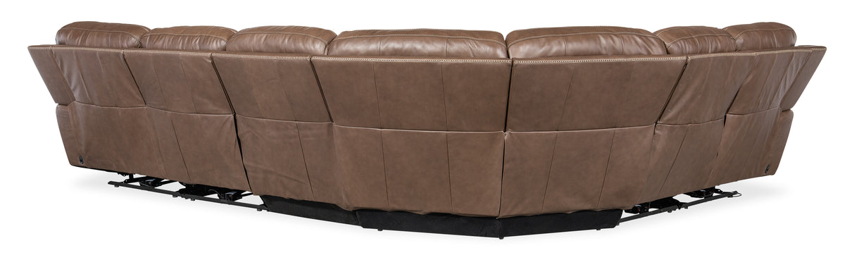 a brown leather couch with black base