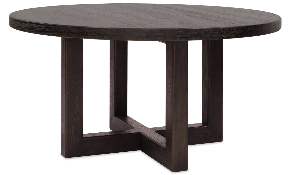 a round wooden table with a cross base