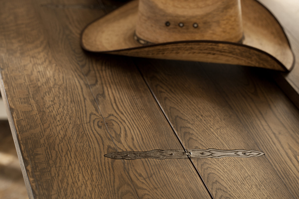 a cowboy hat on a wood floor