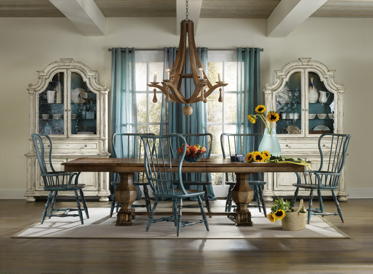 a dining room with a table and chairs