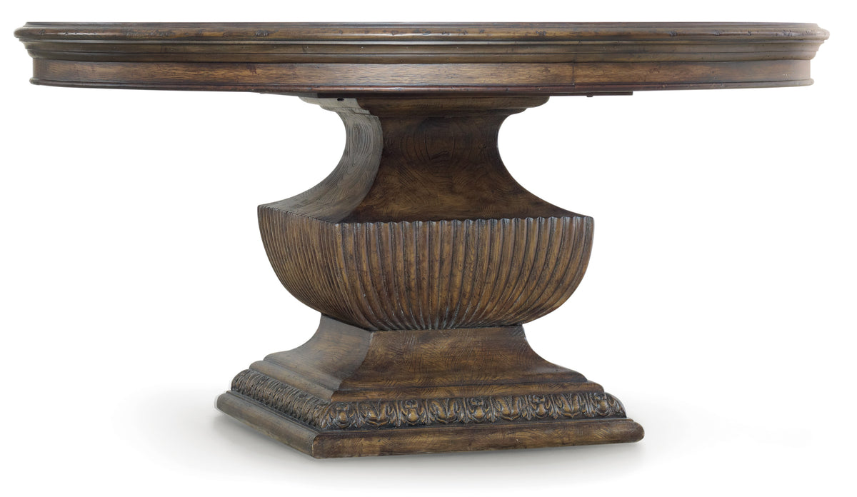 a wooden table with a carved base