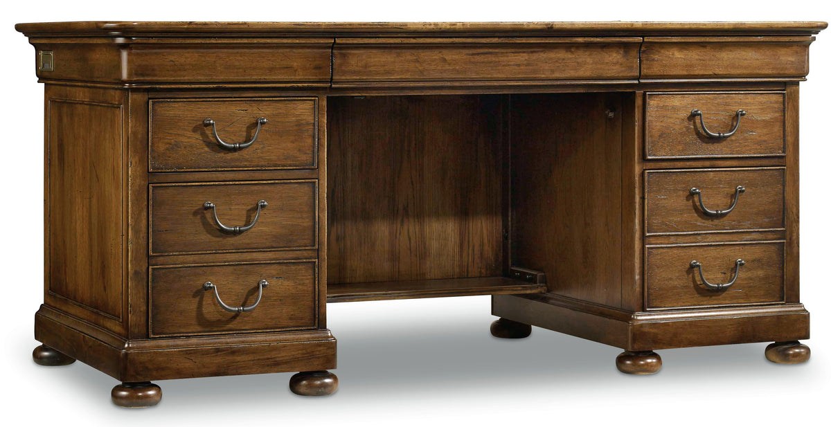a wooden desk with drawers