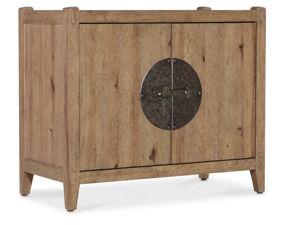 a wooden cabinet with a round door