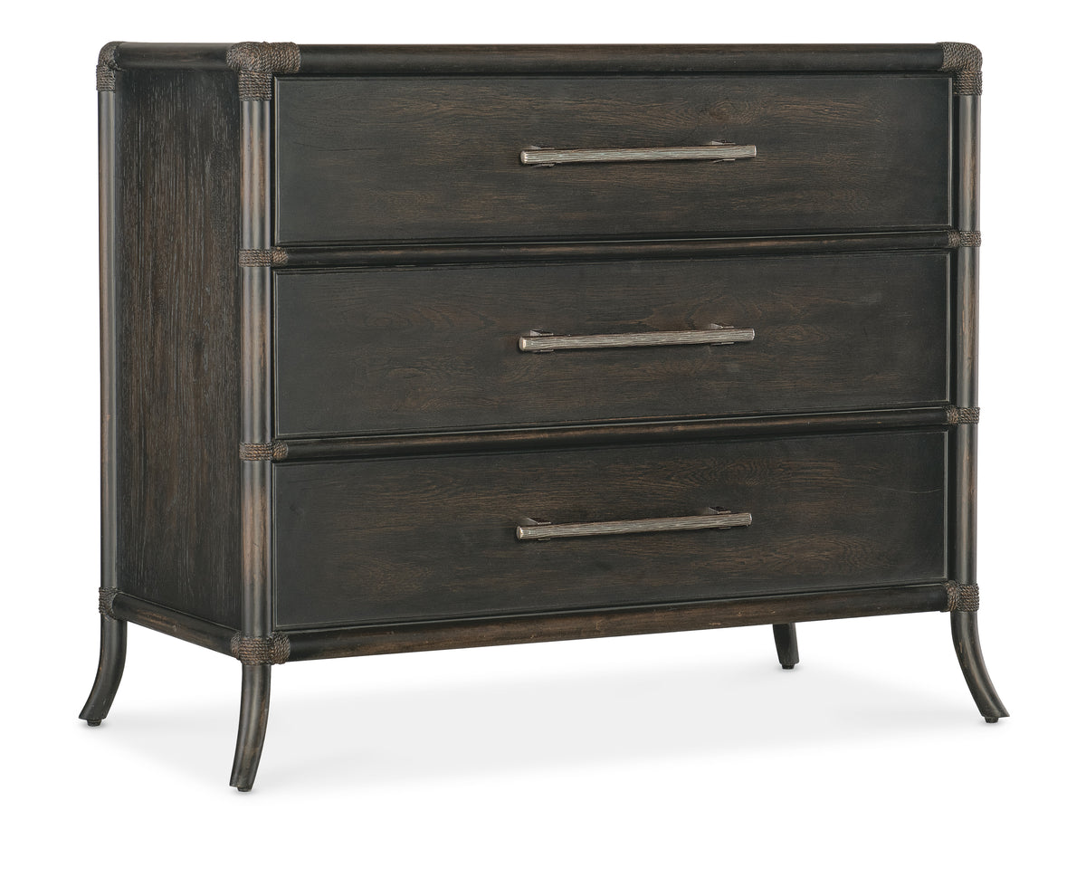 a brown dresser with metal handles