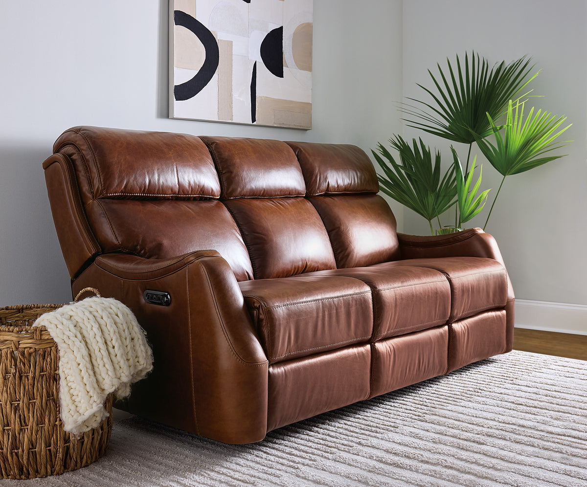 a brown leather couch in a room