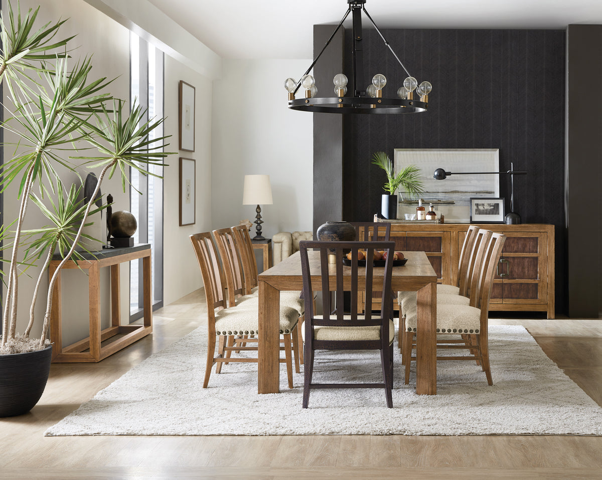 a dining room with a table and chairs
