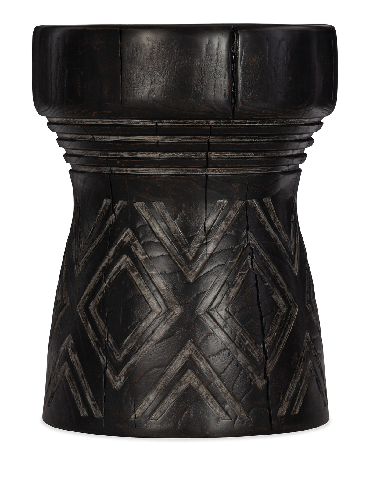 a black wooden cylinder with a pattern on it