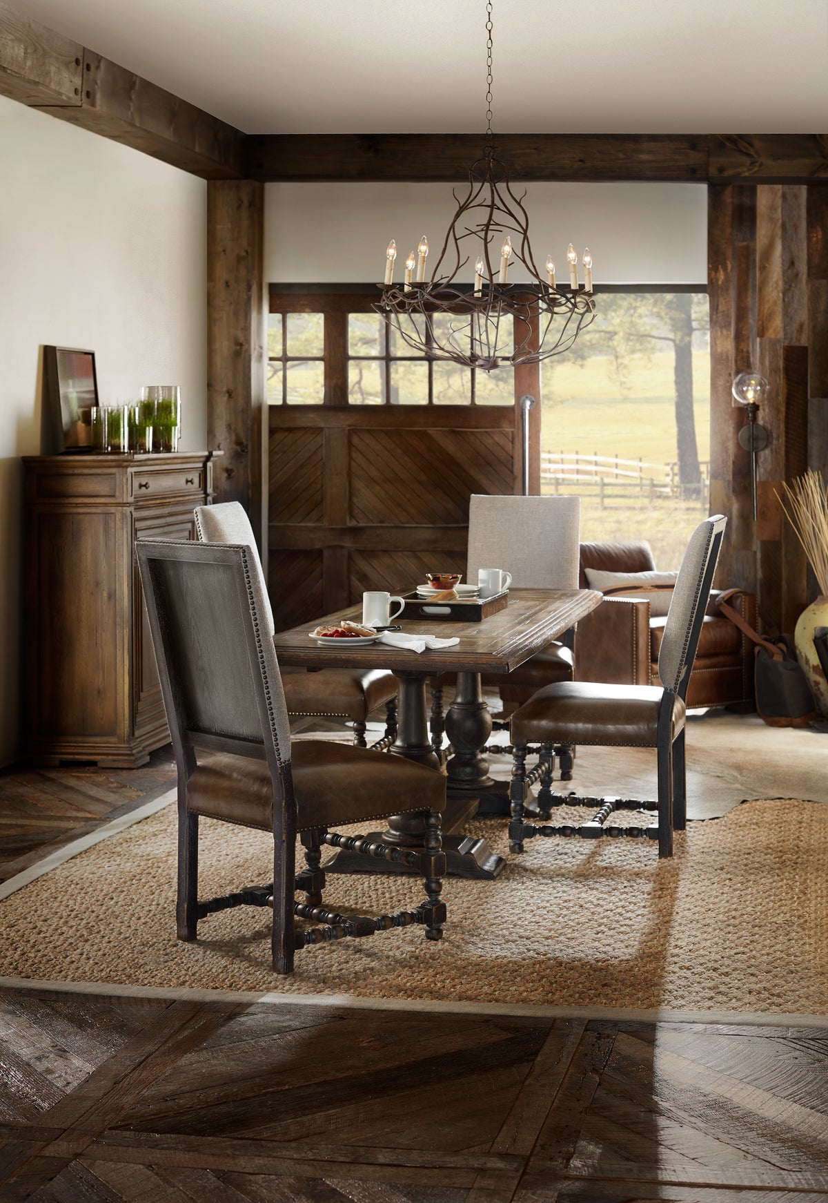 a dining room with a table and chairs