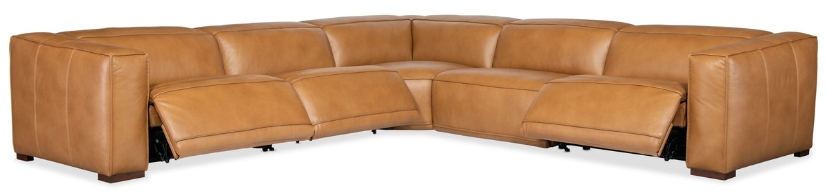 a brown leather couch with a curved corner