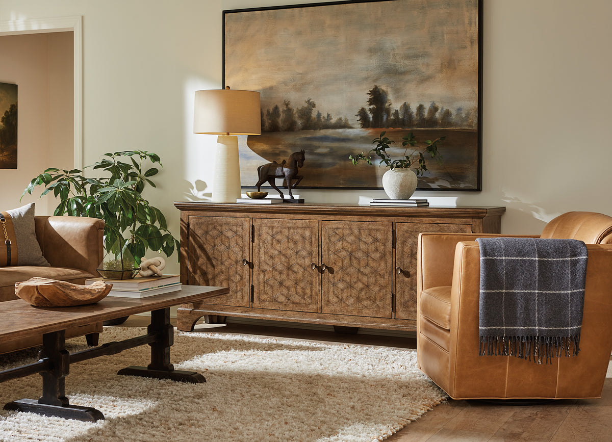 a living room with a large painting on the wall
