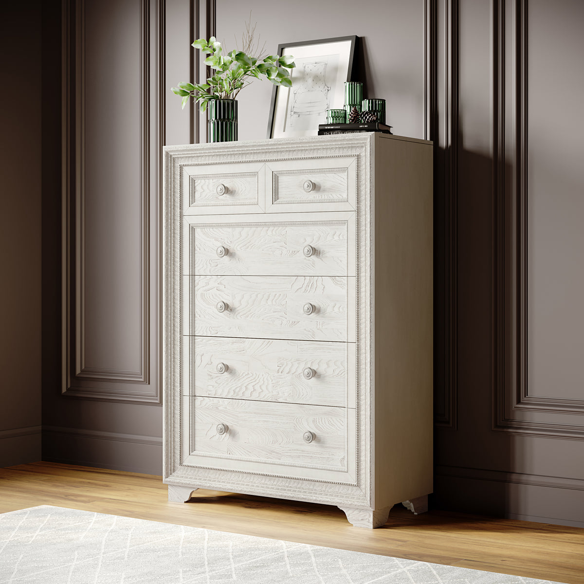 a white dresser with a picture frame and vase on top