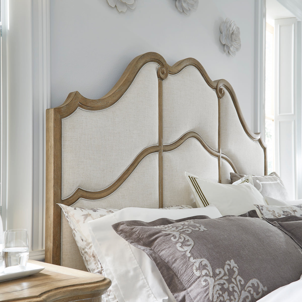 a bed with pillows and a table
