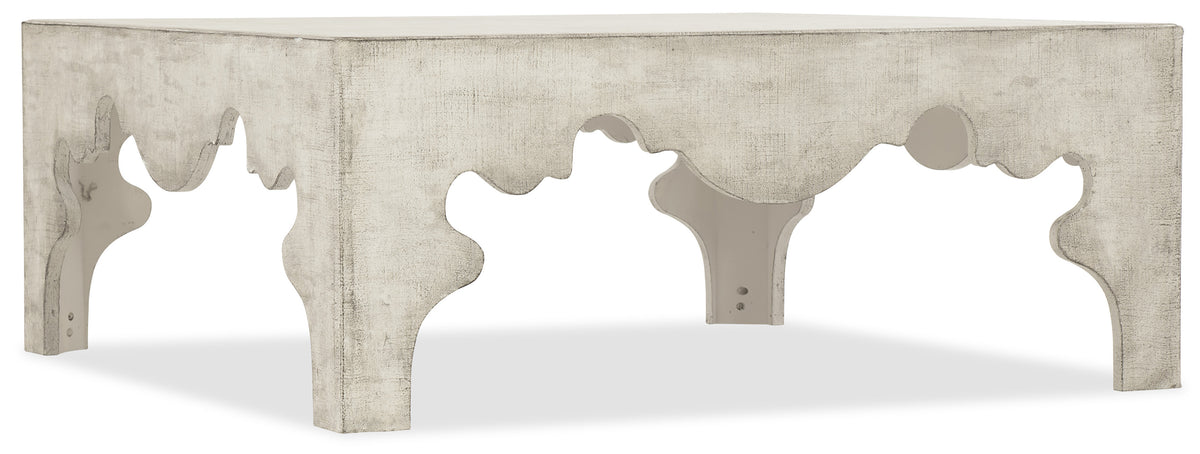 a white table with a carved edge