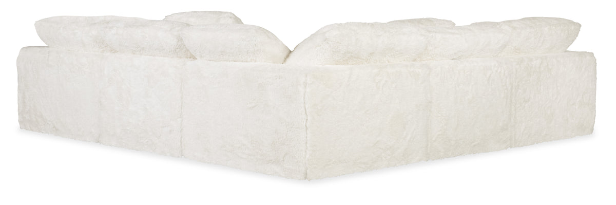 a white couch with pillows
