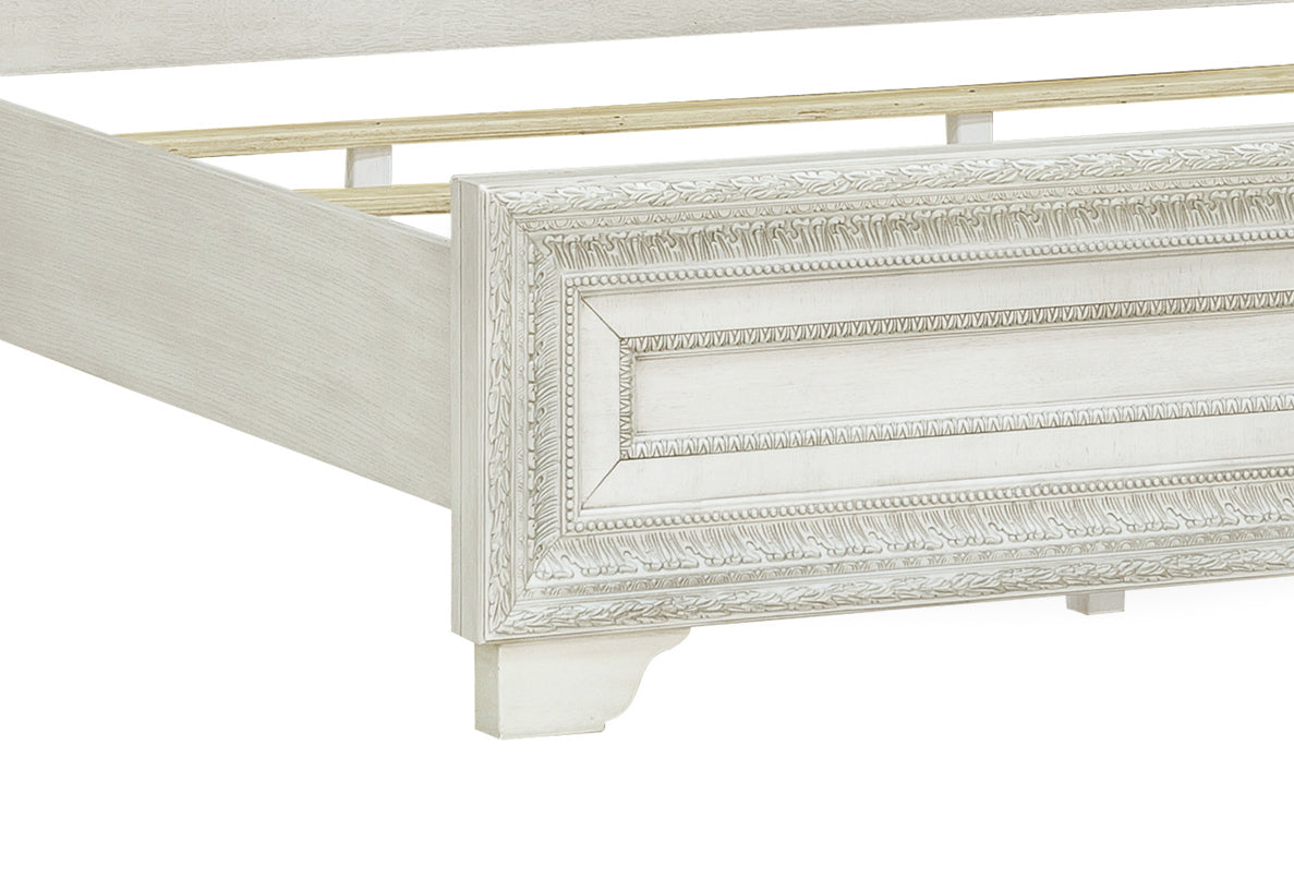 a white bed frame with a wooden frame