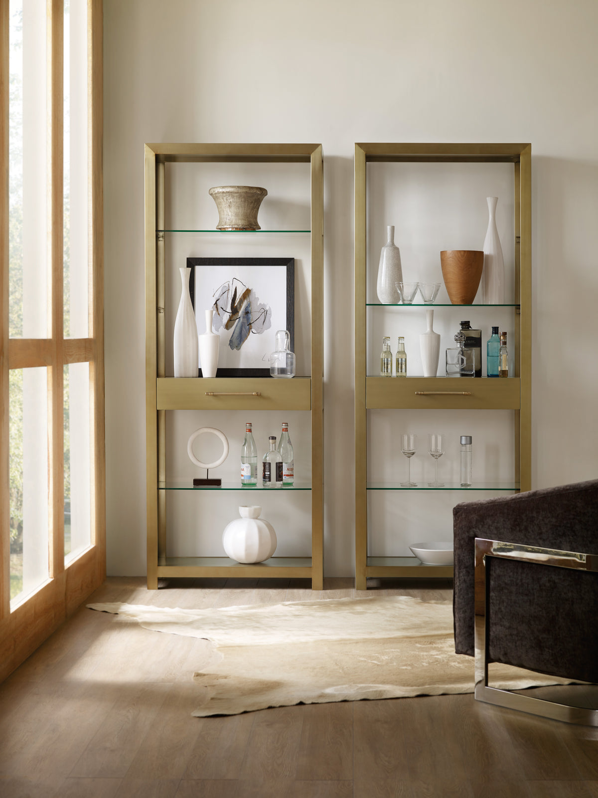 a shelf with glass shelves and vases on it