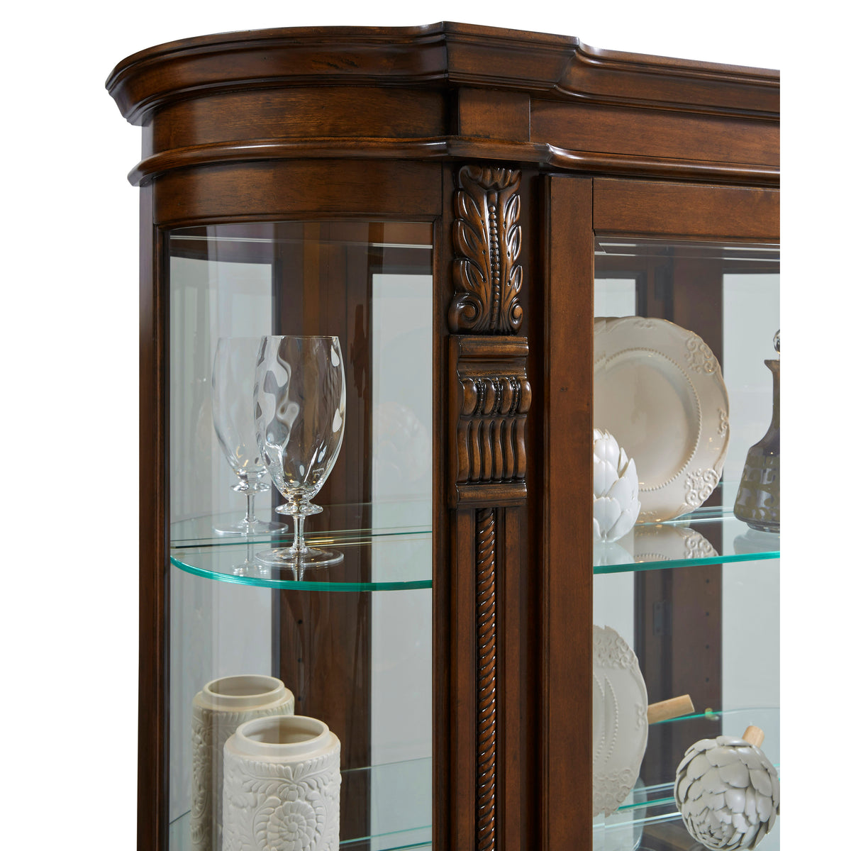 a glass cabinet with a wood frame and a wood carving