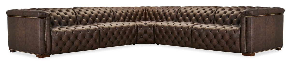 a brown leather couch with buttons