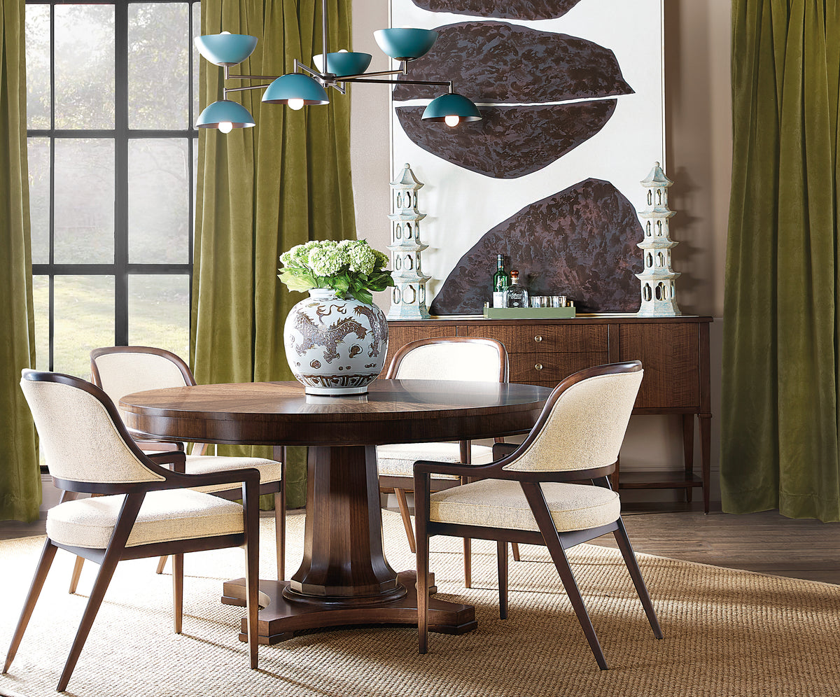 a dining room with a table and chairs