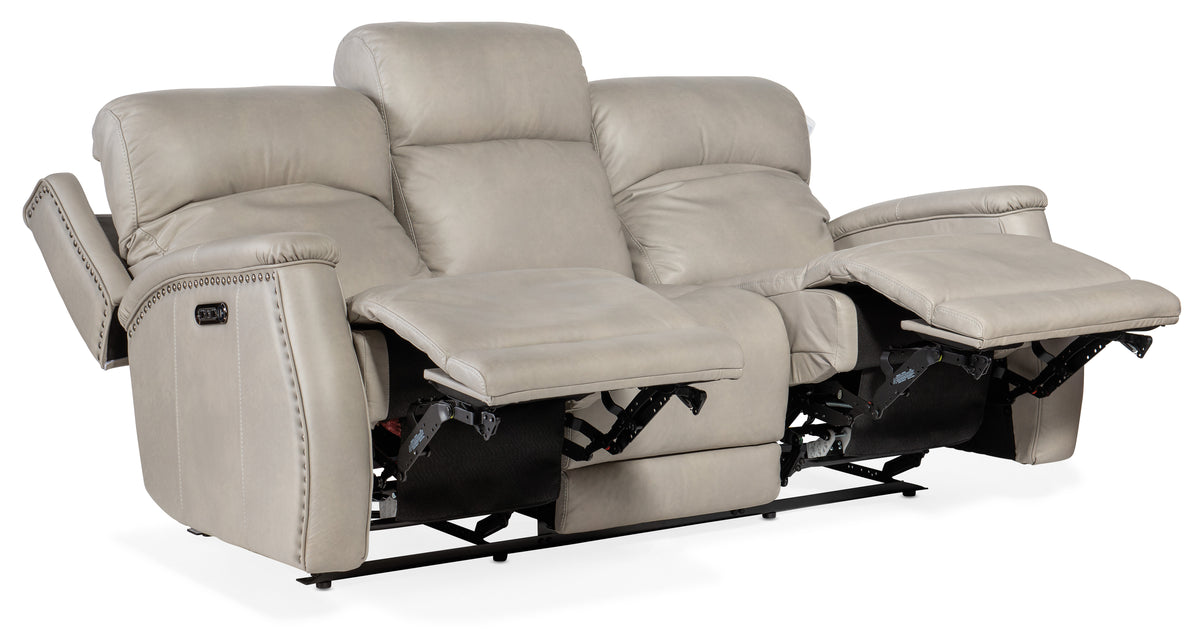 a white reclining couch with two recliners