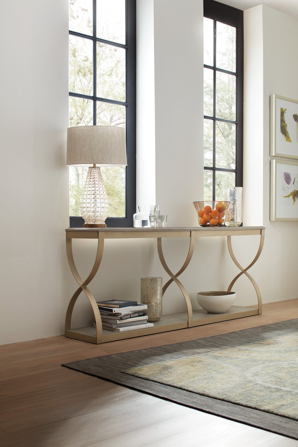 a table with a lamp and vases on it