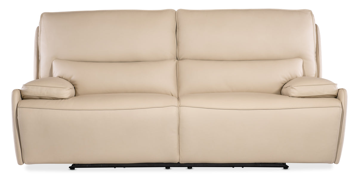 a beige couch with black base