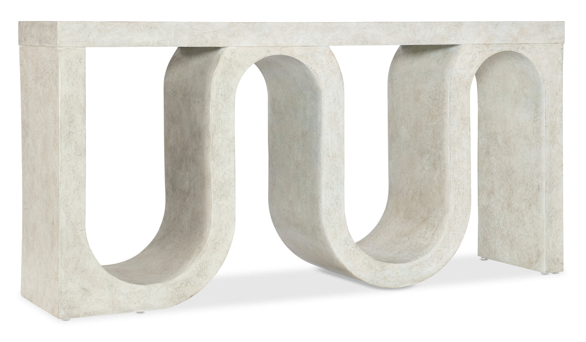 a white stone table with a curved shape