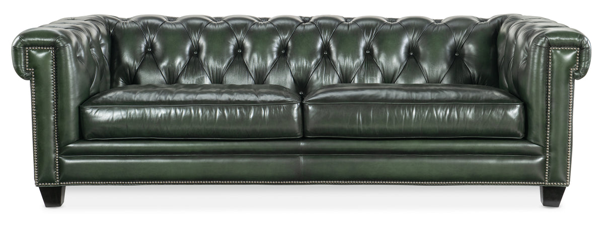 a black leather couch with buttons