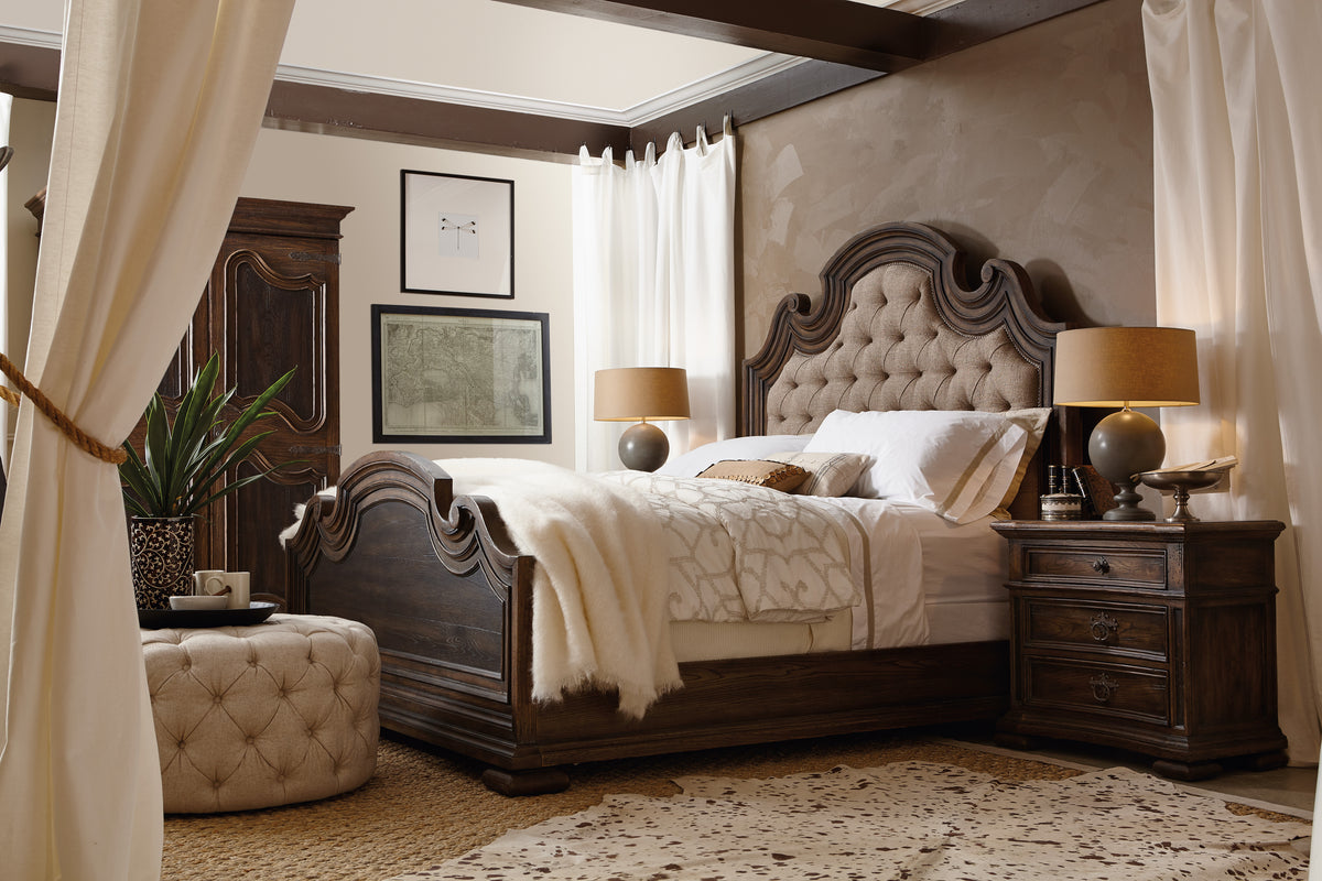 a bedroom with a bed and a table