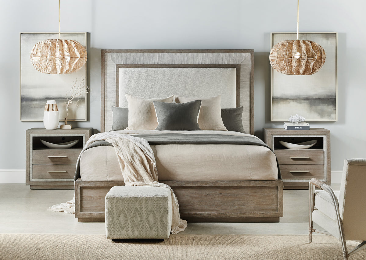 a bedroom with a bed and lamps