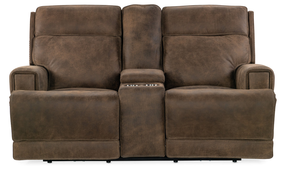 a brown couch with armrests