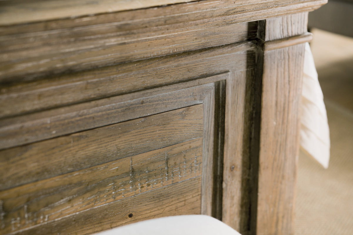 a wood paneling with a white pillow