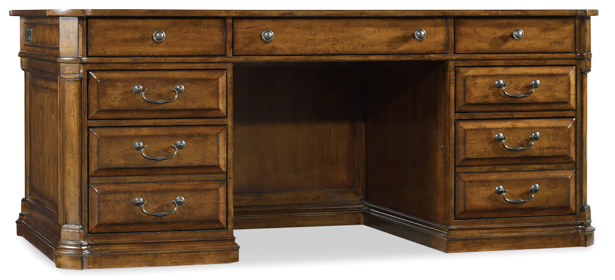 a wooden desk with drawers