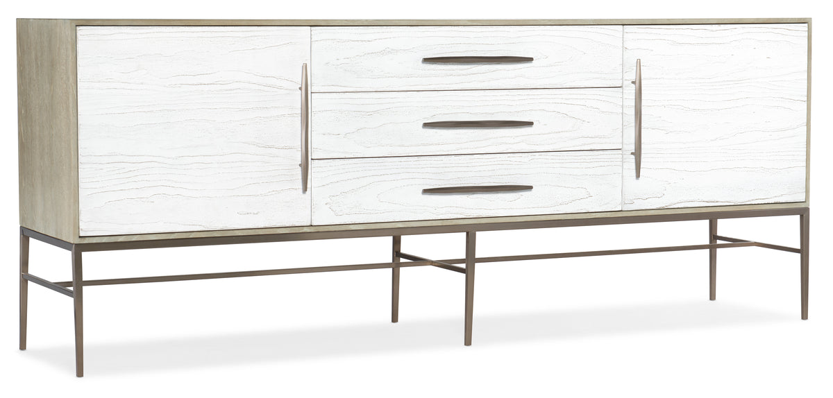 a white dresser with metal legs