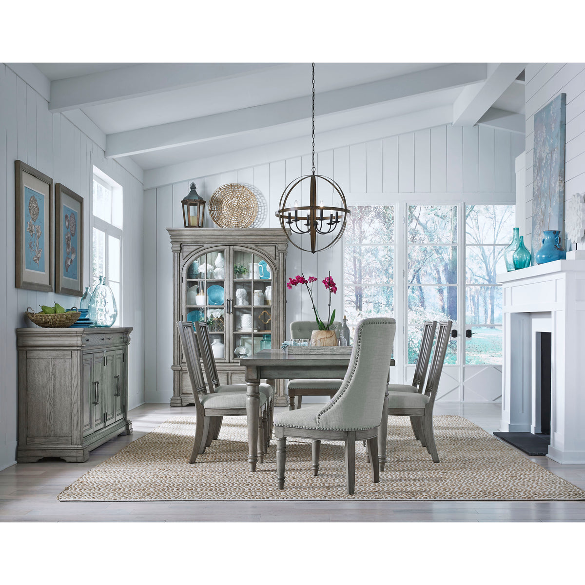 a dining room with a fireplace and a table