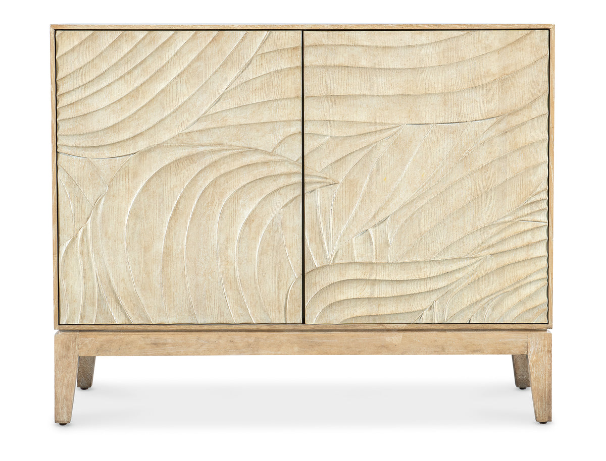 a wooden cabinet with a pattern on it