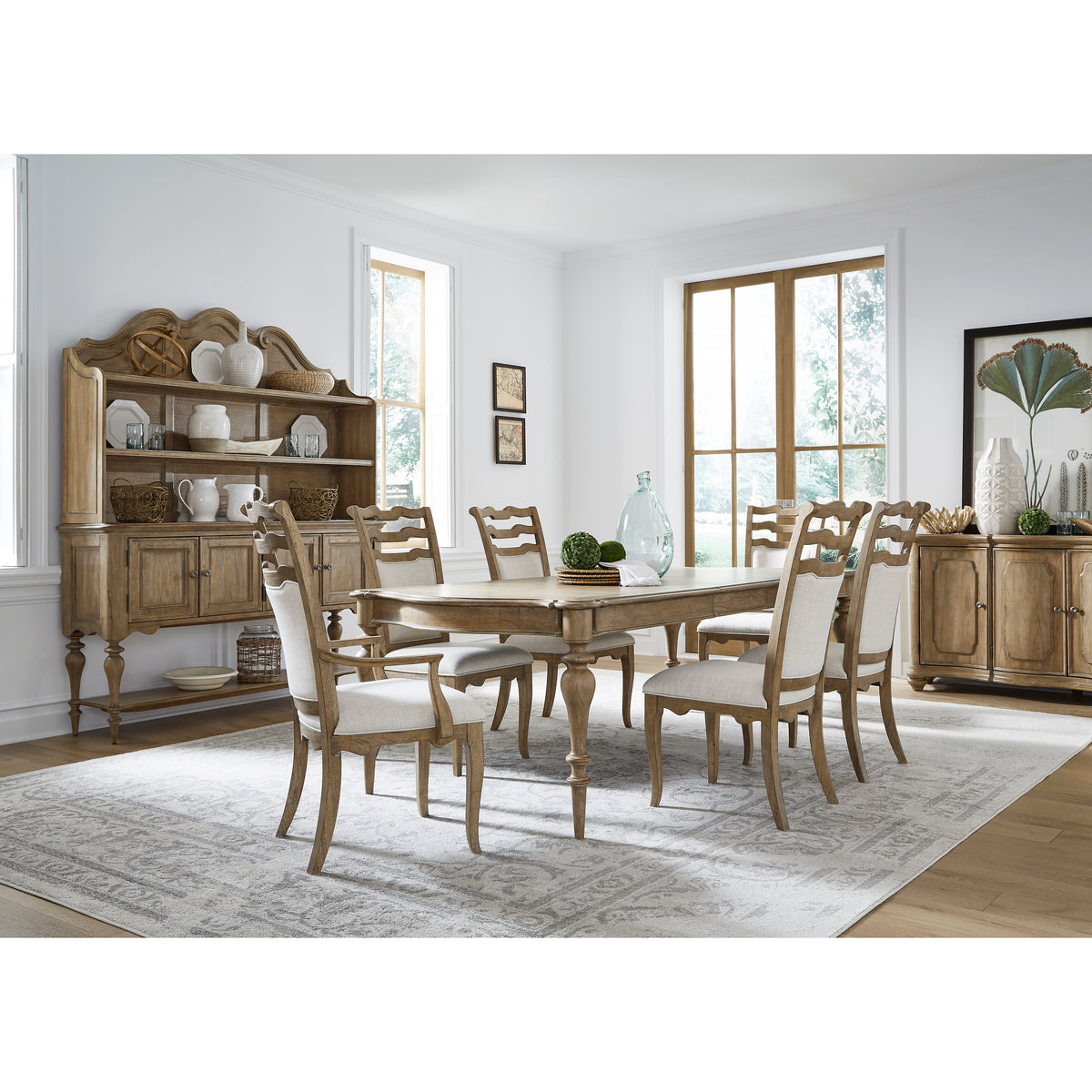 a dining room with a table and chairs