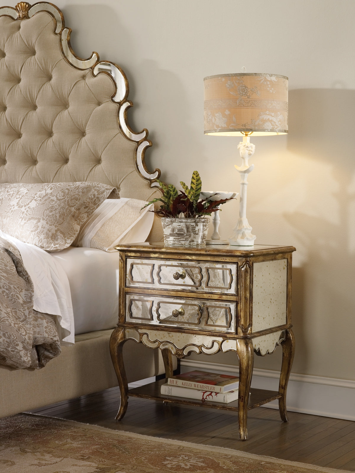 a nightstand next to a bed