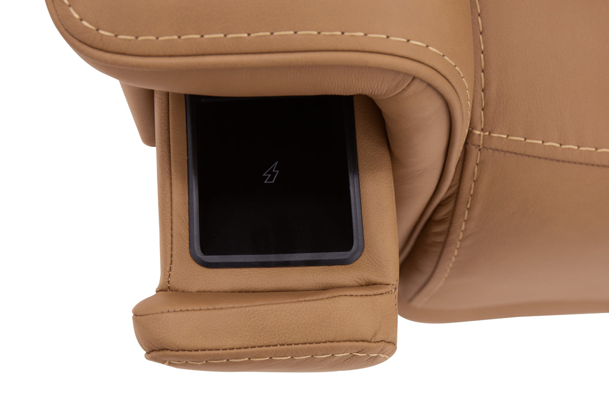 a phone in a leather arm rest
